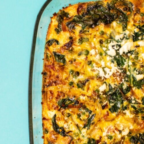 Baked eggs in glass baking tray with feta topping