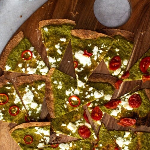 Slices of tortilla pizza with pesto and feta