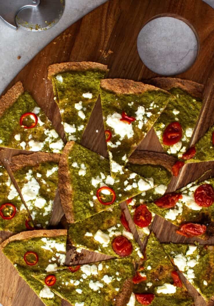 Slices of tortilla pizza with pesto and feta