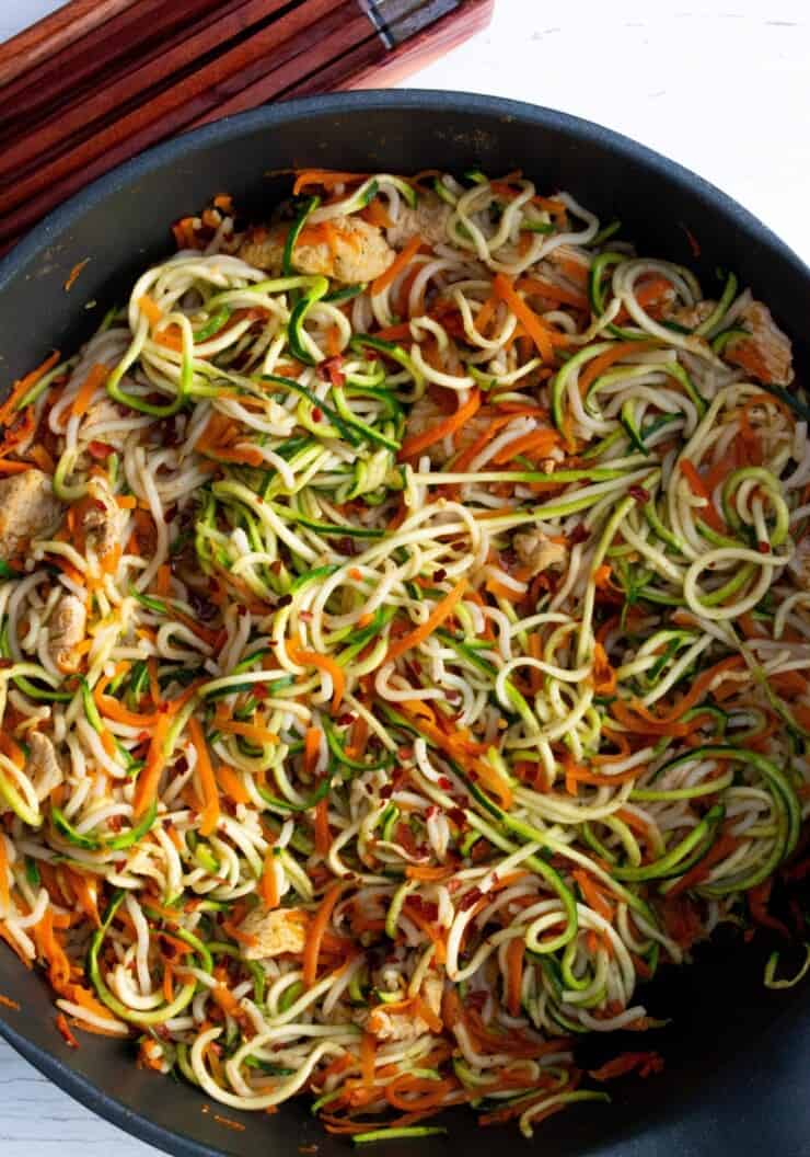 Noodles and spiralised vegetables in pan with turkey