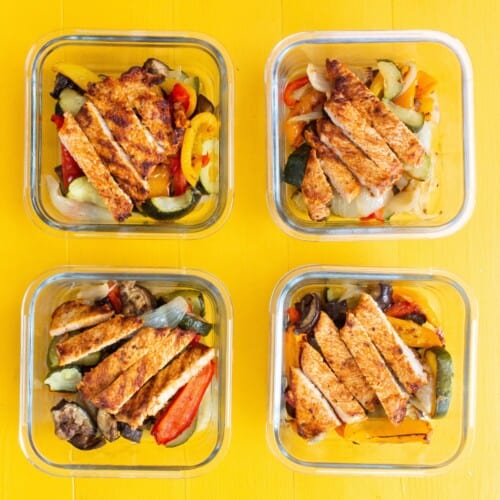 Overhead shot of 4 turkey meal prep glass containers with roasted Veg