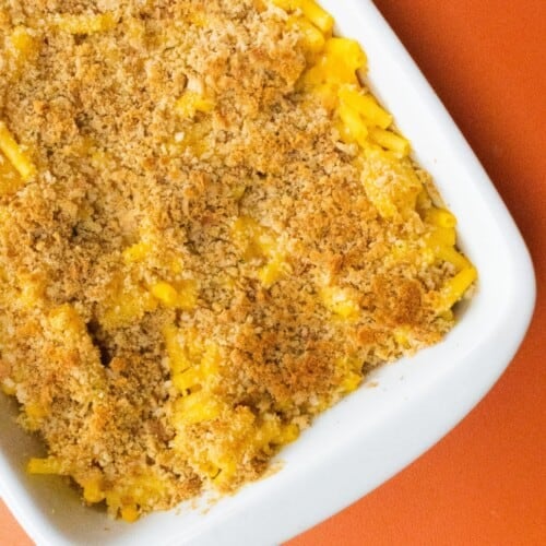 Overhead shot of large white baking dish fill with Mac and cheese with a crispy topping