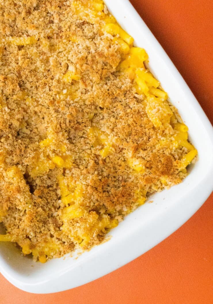 Overhead shot of large white baking dish fill with Mac and cheese with a crispy topping