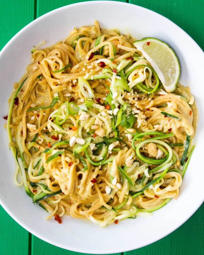 Close up shot of bowl of vegetable noodles with crunchy vegetables