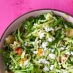 Close up shot of courgette salad with olives and feta