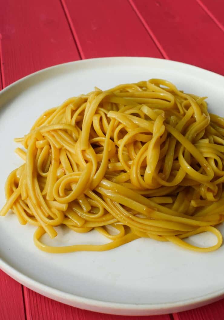 Photo of marmite spaghetti on a white plate
