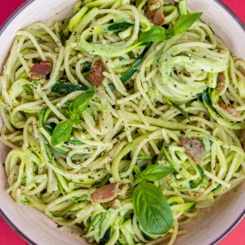 Overhead shot of bowl of spaghetti, spiralised courgettes and bacon