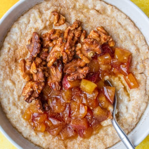 Porridge with apple sauce and walnuts in a bowl
