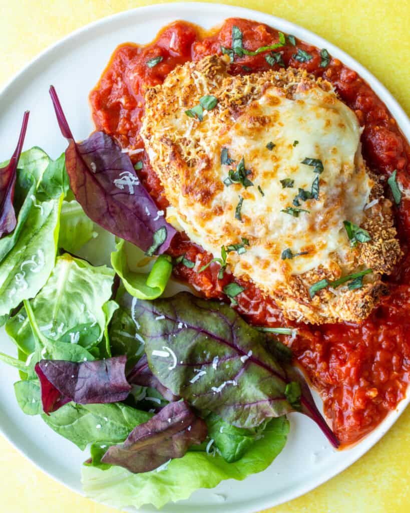 Crispy Baked Chicken Parmigiana with Green Salad - Beat the budget