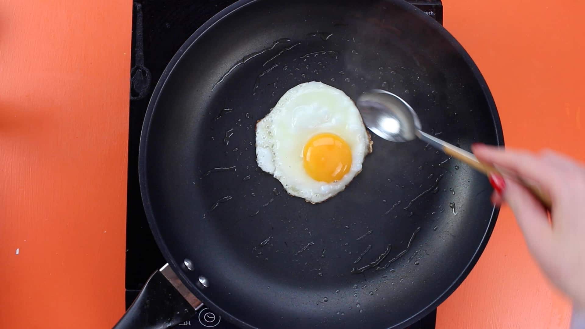Egg frying in pan