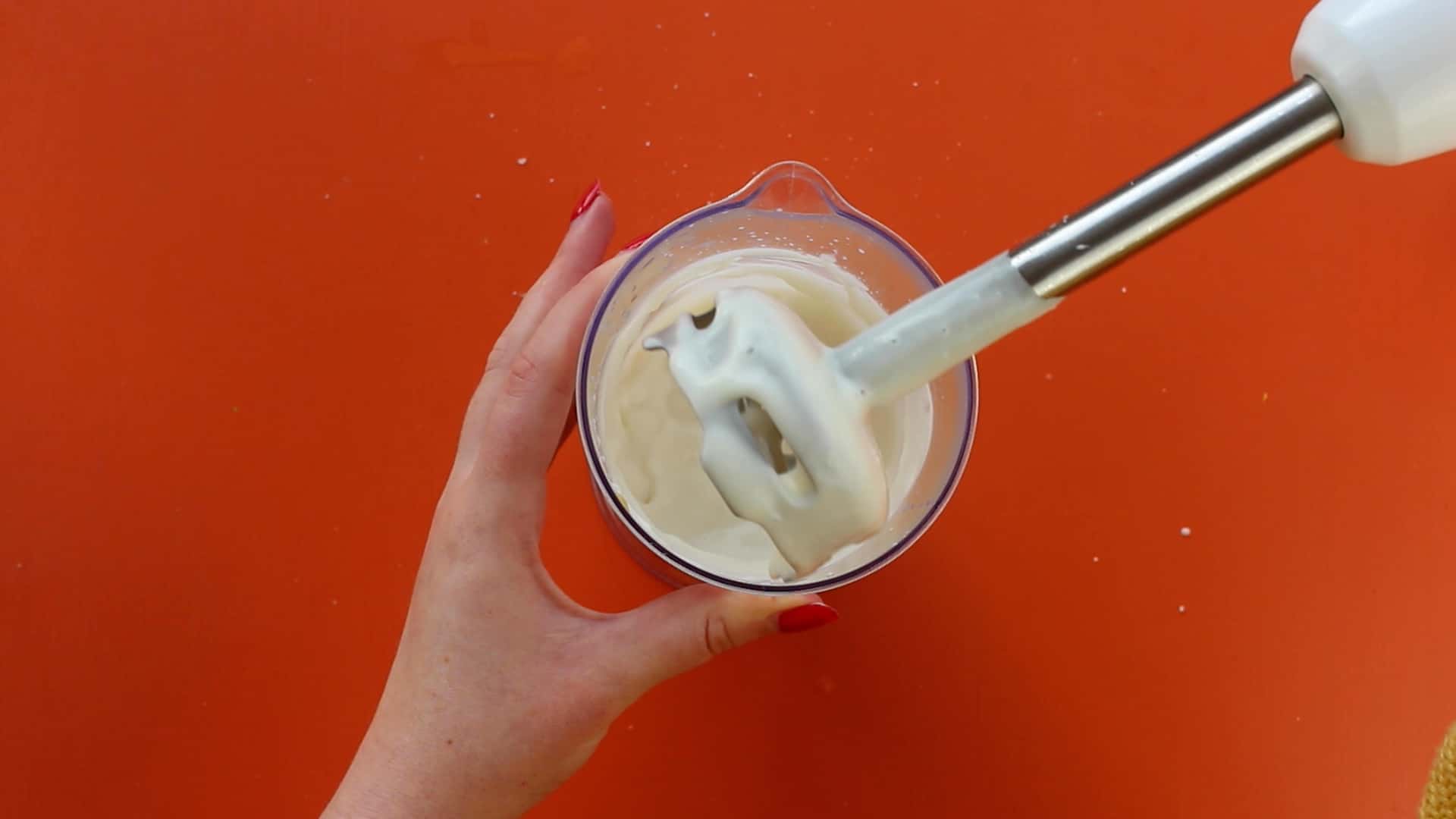Hand blender being used to make mayonnaise