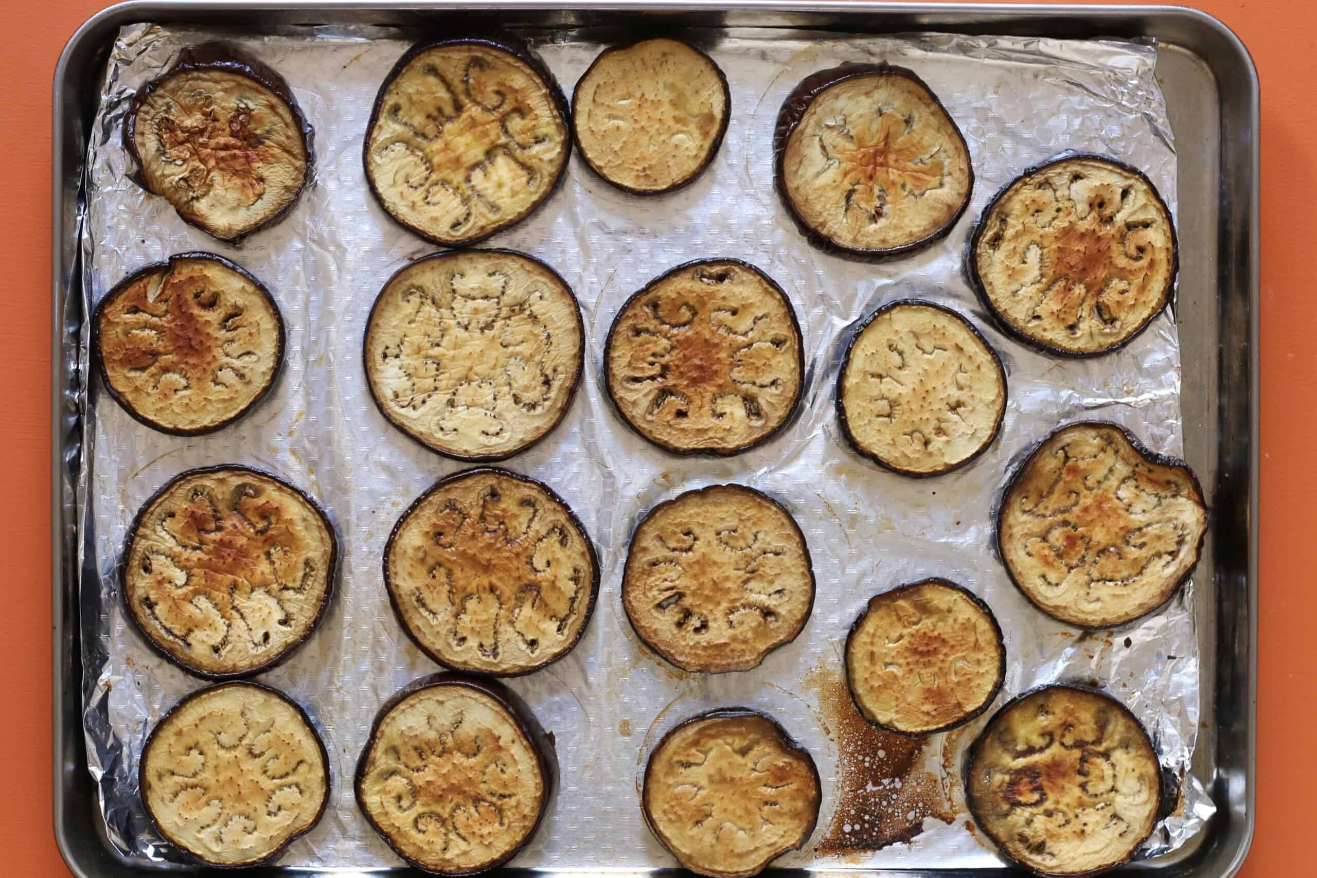 Roasted aubergines on foil lined baking tray