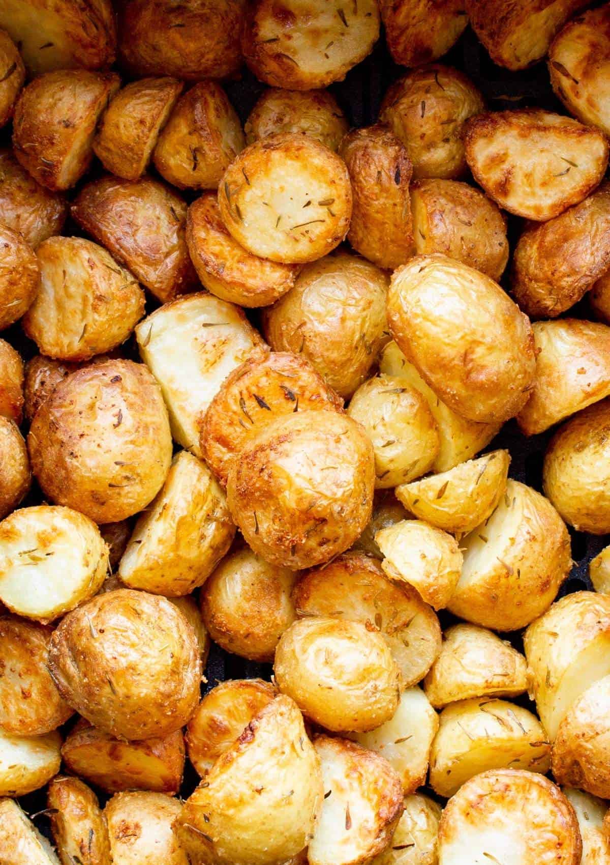 Close up of golden browned new potatoes baked in air fryer after cooking.