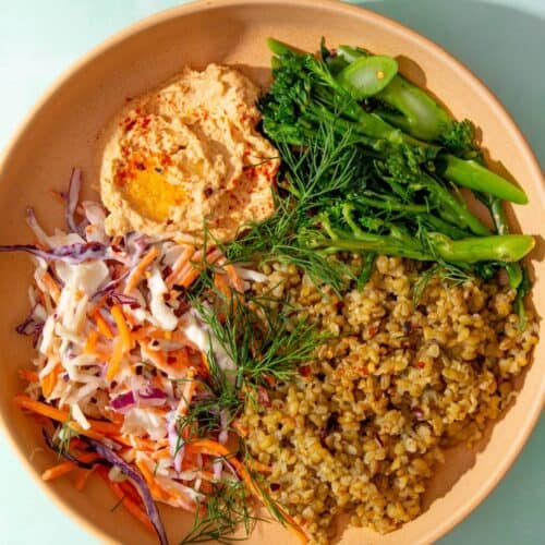 Nando's inspired grain bowl with houmous, tender stem broccoli, coleslaw and Freekar (cooked cracked wheat).
