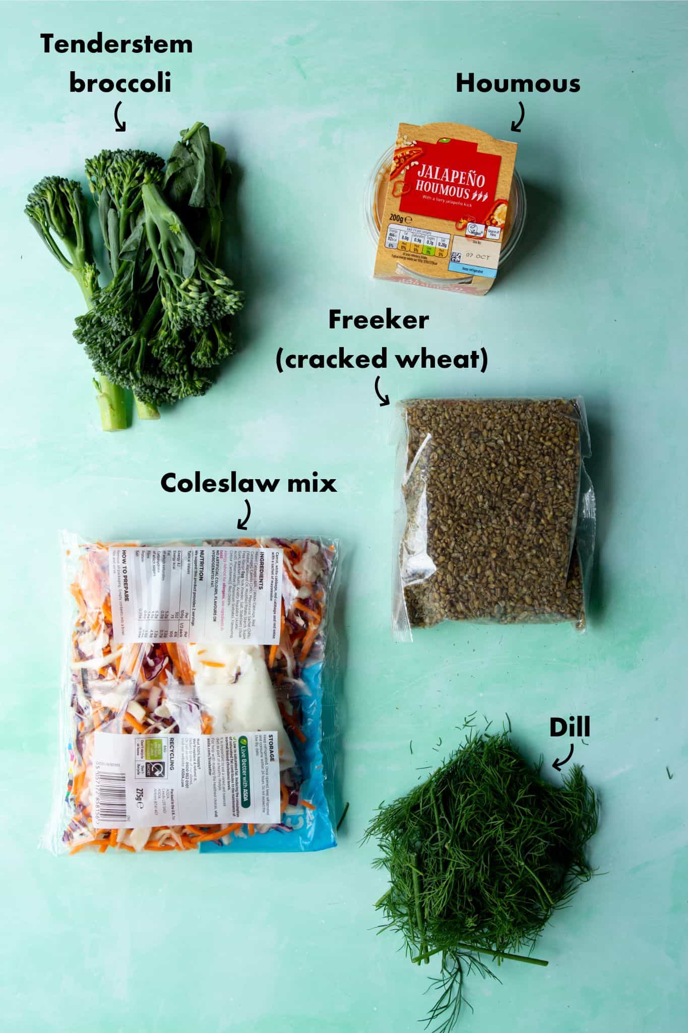 Ingredients to make a rainbow grain bowl : humous, tender stem broccoli, coleslaw mix, Freeker (cracked wheat) and fresh dill.