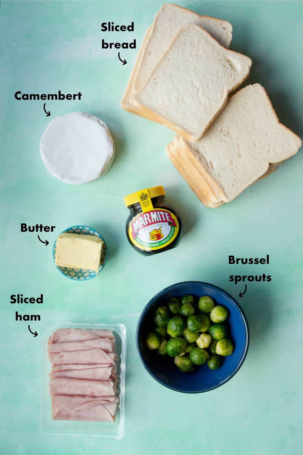 Ingredients to make a Marmite Ham & Camembert Festive Toastie including Camembert, white bread, Marmite, Brussel sprouts, ham and butter.