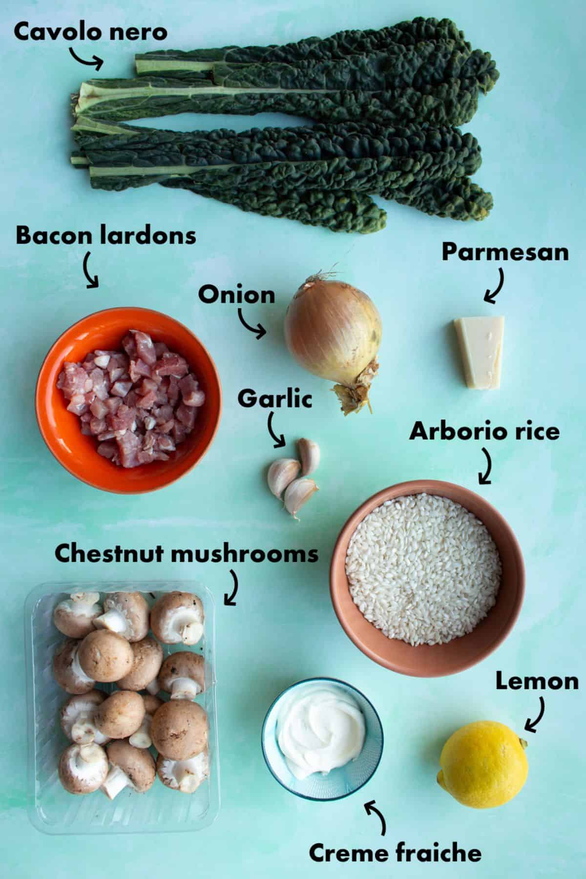Ingredients to make green risotto laid out on a pale blue back ground and labelled.