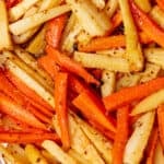 Slices Carrots and parsnips roasted and covered with a glaze.