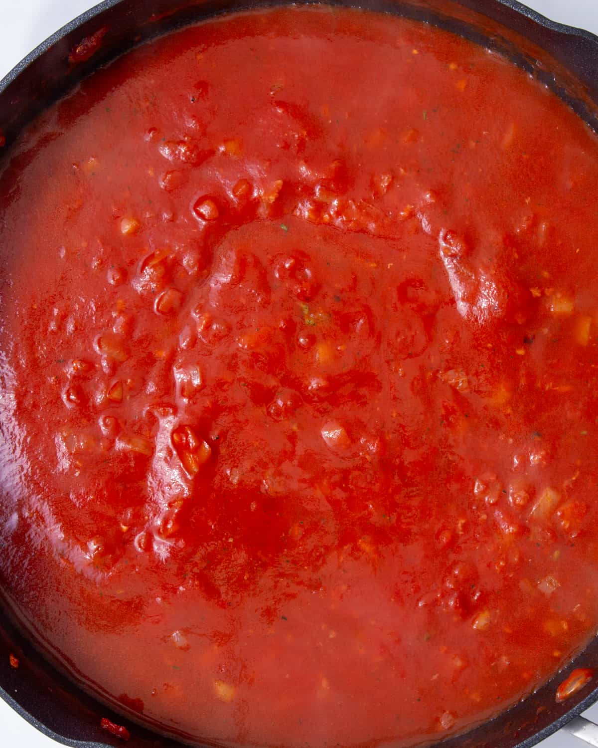 Chopped tomatoes in a pan.