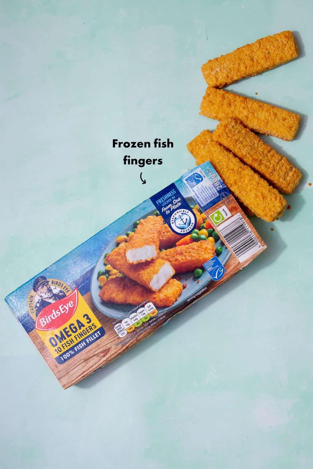 A alarge pack oof Bird'sEye Omega 3 10 fish fingers, with 4 fish fingers outside the packaging.