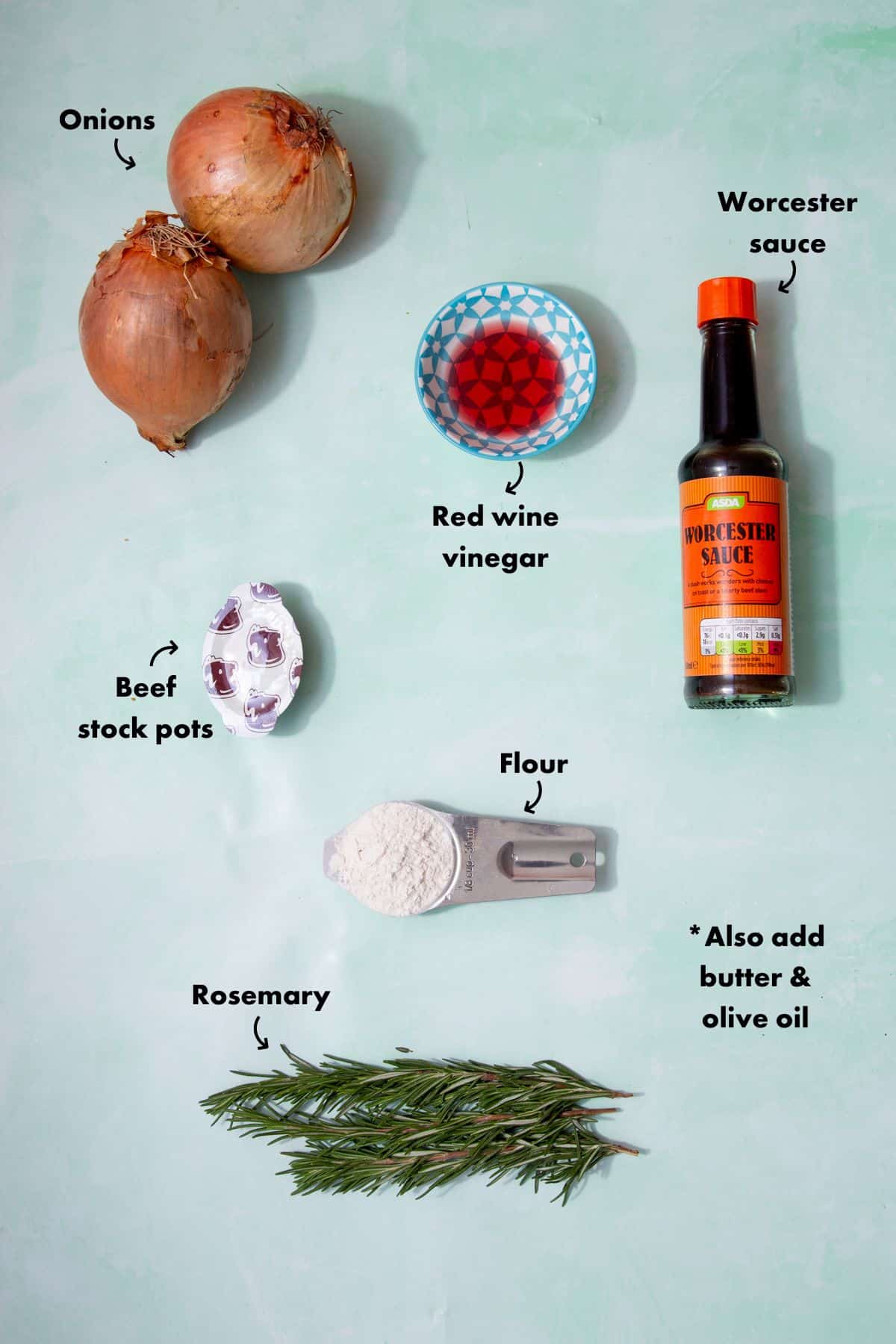 Ingredients to make onion gravy laid out on a pale blue background and labelled.