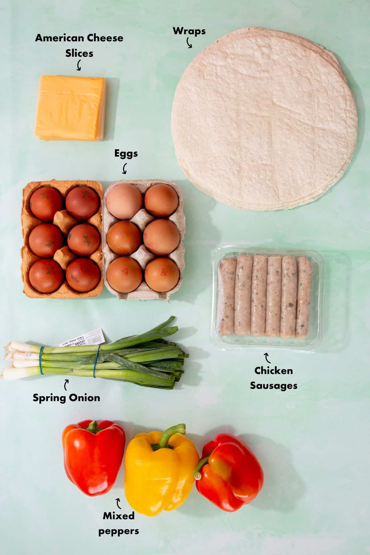 Ingredients to make the brurritos laid out on a pale blue background and labelled.