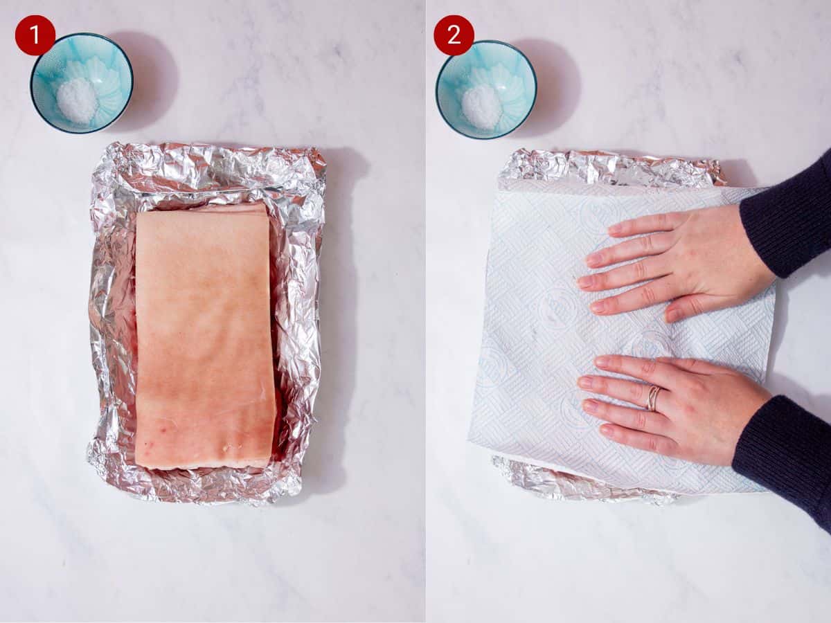 2 step by step photos, the first with a pork belly on foil with a little bowl of salt and the second with 2 hands  on some kitchen roll covering the pork.