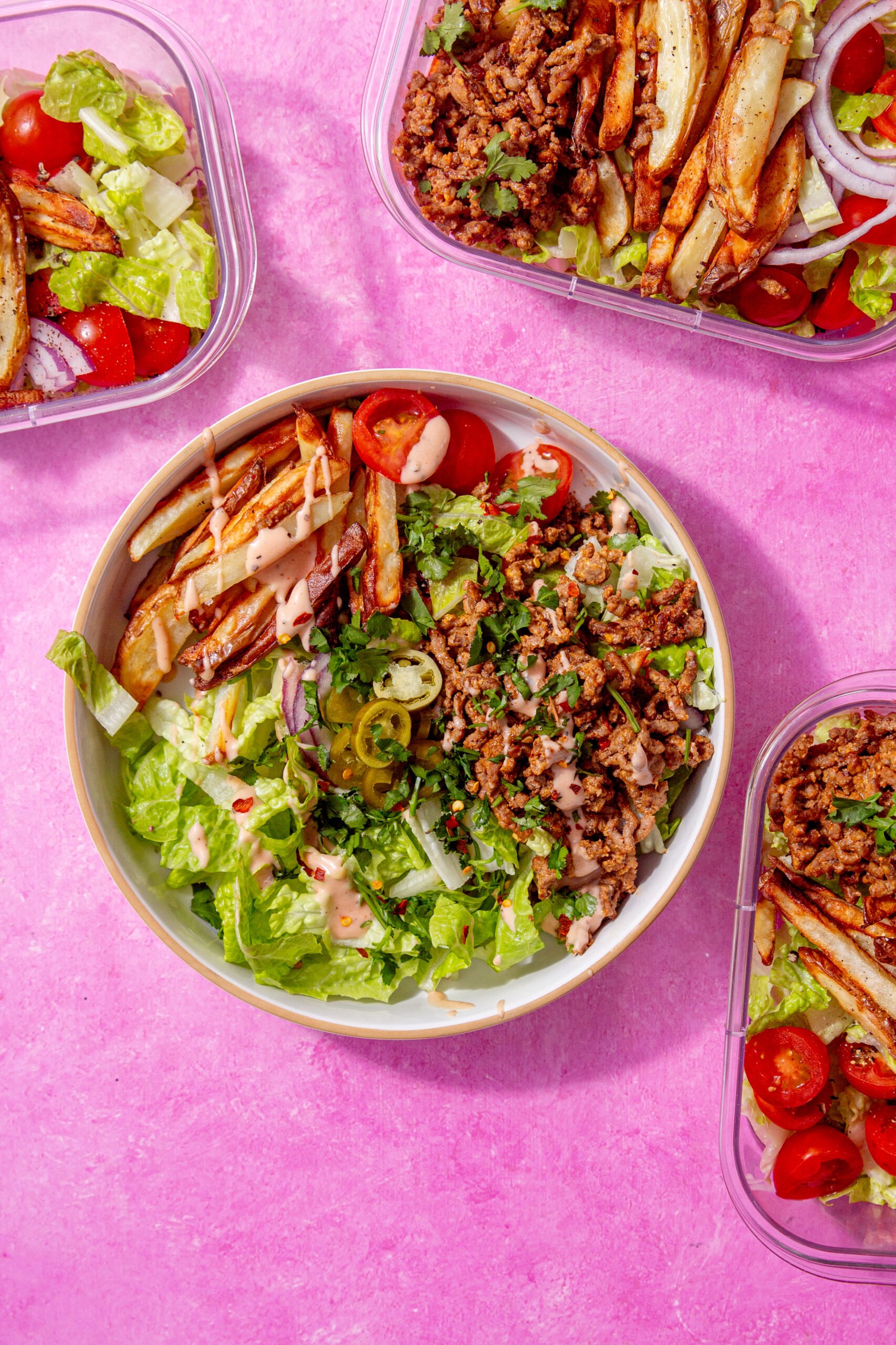 prepared burger bowl on a pink background