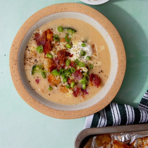 prepared hash brown potato soup with bacon, chives and sour cream toppings