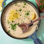 prepared creamy lemon sauce topped with lemon slices and parsley