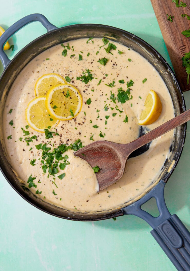 prepared creamy lemon sauce topped with lemon slices and parsley