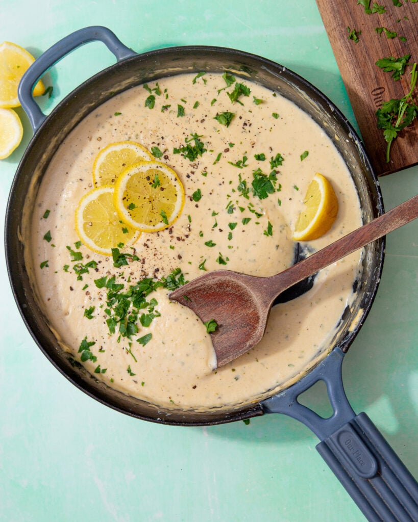 prepared creamy lemon sauce topped with lemon slices and parsley