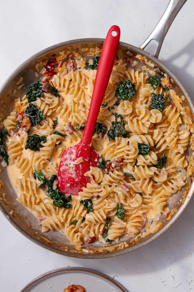 Pasta, sauce, and prawns all mixed together, coated in a creamy sauce.