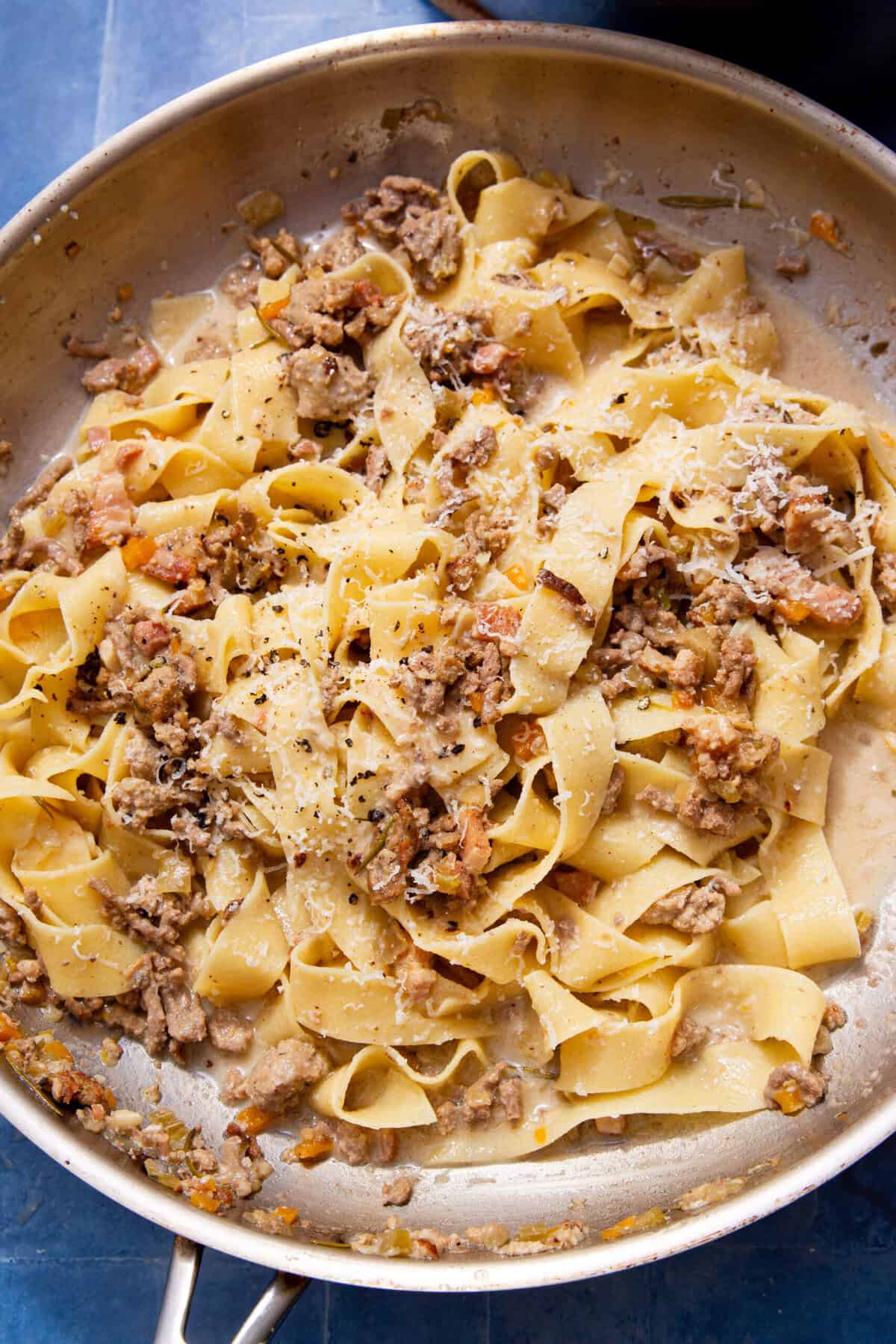 Fresh pappardelle tossed in ragu bianco with beef, sausage and pancetta, topped with grated parmesan and cracked black pepper.