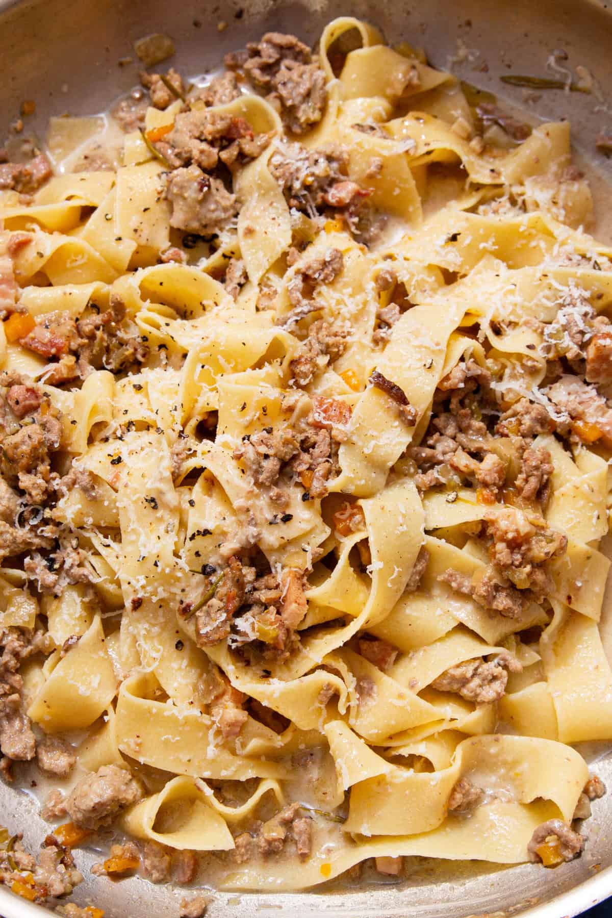 Creamy ragu bianco pasta with beef and sausage pieces, pancetta, vegetables and parmesan.