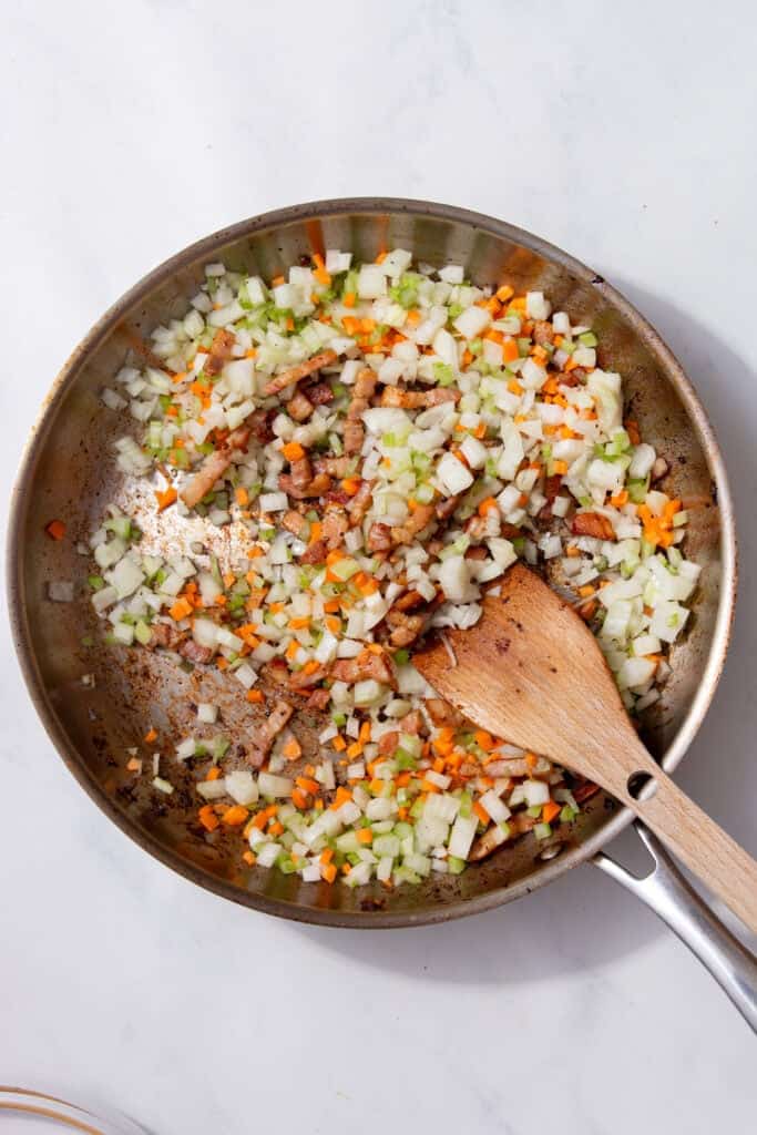 Chopped onion, celery and carrot added to crispy pancetta.