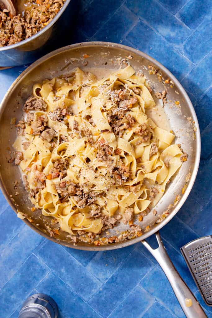 white ragu tossed through parpadelle.