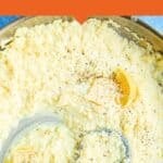 A skillet filled with Creamy Rice, garnished with black pepper and lemon wedges, with a wooden spoon scooping some rice. The text above reads, Simple & Delicious Creamy Rice Recipe on an orange background.