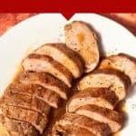 Sliced pork loin with garlic butter sauce arranged on a white plate against a red marbled background. Text above reads: Perfect for every time. Try this Pork Loin Crock Pot Recipe with Heavenly Garlic Butter Sauce.