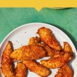 A white plate filled with golden-brown Shake and Bake Chicken tenders sits on a green surface. At the top, a yellow banner reads: “PERFECT FOR EVERY TIME—Shake n Bake Chicken. Couldn’t be easier.”.