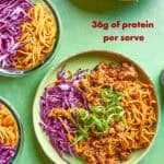 Bowls filled with mango sticky noodles, purple cabbage, ground meat, and green onions are arranged on a green surface. Text reads: Mango Sticky Noodle Bowls, 36g of protein per serve, Meal prep lunches in less than 15 minutes.