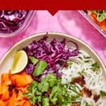 A vibrant bowl of rainbow noodles with shredded purple cabbage, carrot ribbons, cilantro, seasoned minced protein, chili sauce, lime wedge, and rice noodles on a pink background. Text reads: “Meal Prep Rainbow Noodles.”.
