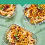 Glass containers of sweetcorn pasta salad, topped with chorizo and green onions, sit on a green surface. Text above reads: “Creamy Sweetcorn Pasta Salad with Chorizo. www.beatthebudget.com”.