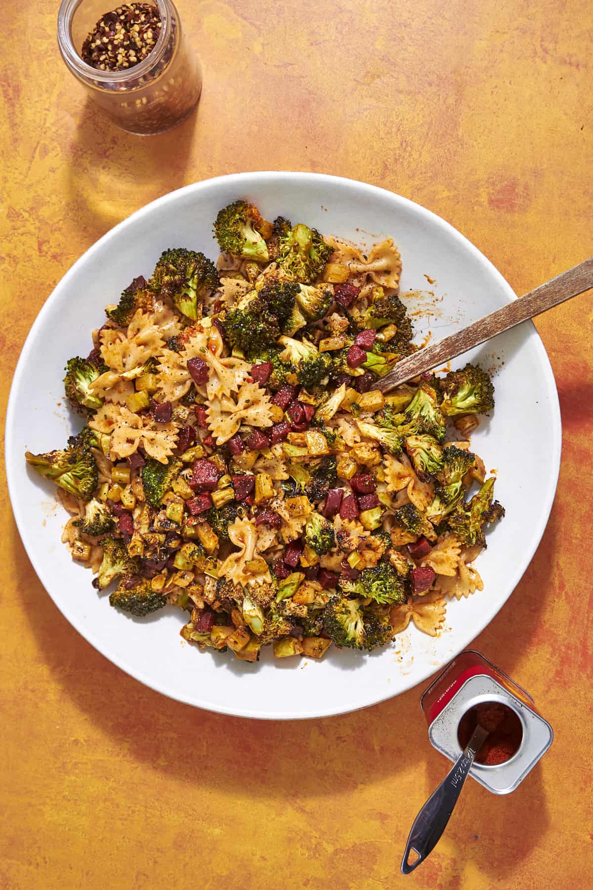 Close-up of broccoli stalk pasta with chorizo showing the smoky paprika coating