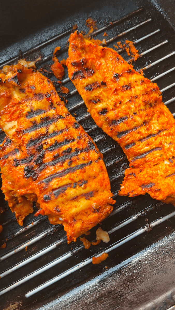 Peri peri yoghurt dressing being whisked together in a large bowl