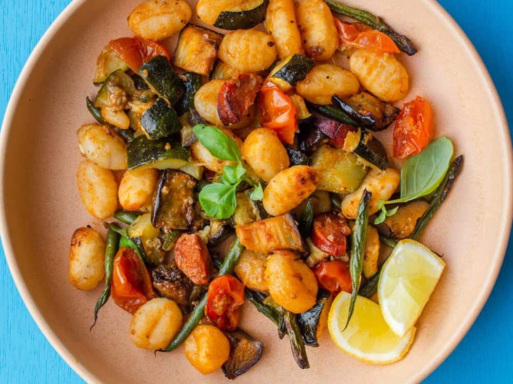 Overhead shot of bowl of Crispy Roasted Gnocchi with Chorizo and Vegetables