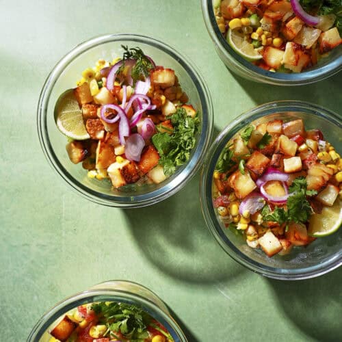 Hot honey halloumi bowl with charred corn, chickpeas and a zingy lime yogurt dressing.
