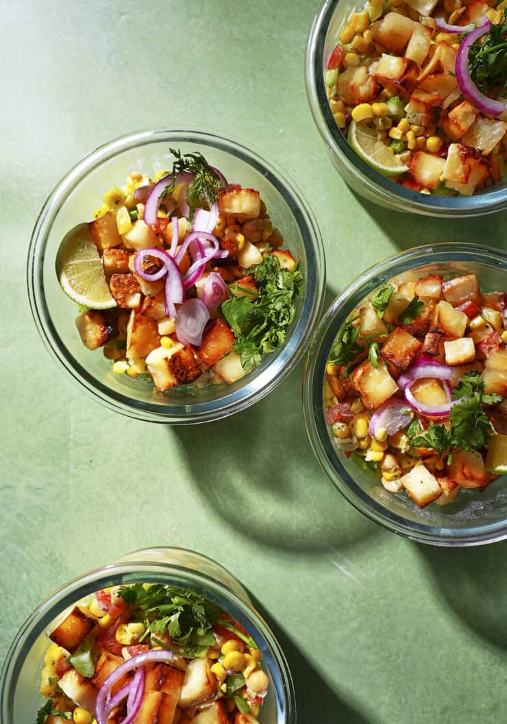 Hot honey halloumi bowl with charred corn, chickpeas and a zingy lime yogurt dressing.
